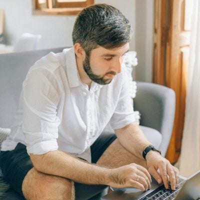 Photo by Nataliya Vaitkevich: https://www.pexels.com/photo/a-man-using-a-laptop-5411999/